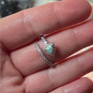 Size 9. Lab grown pale green fire opal on rhodium plating. SRP $112